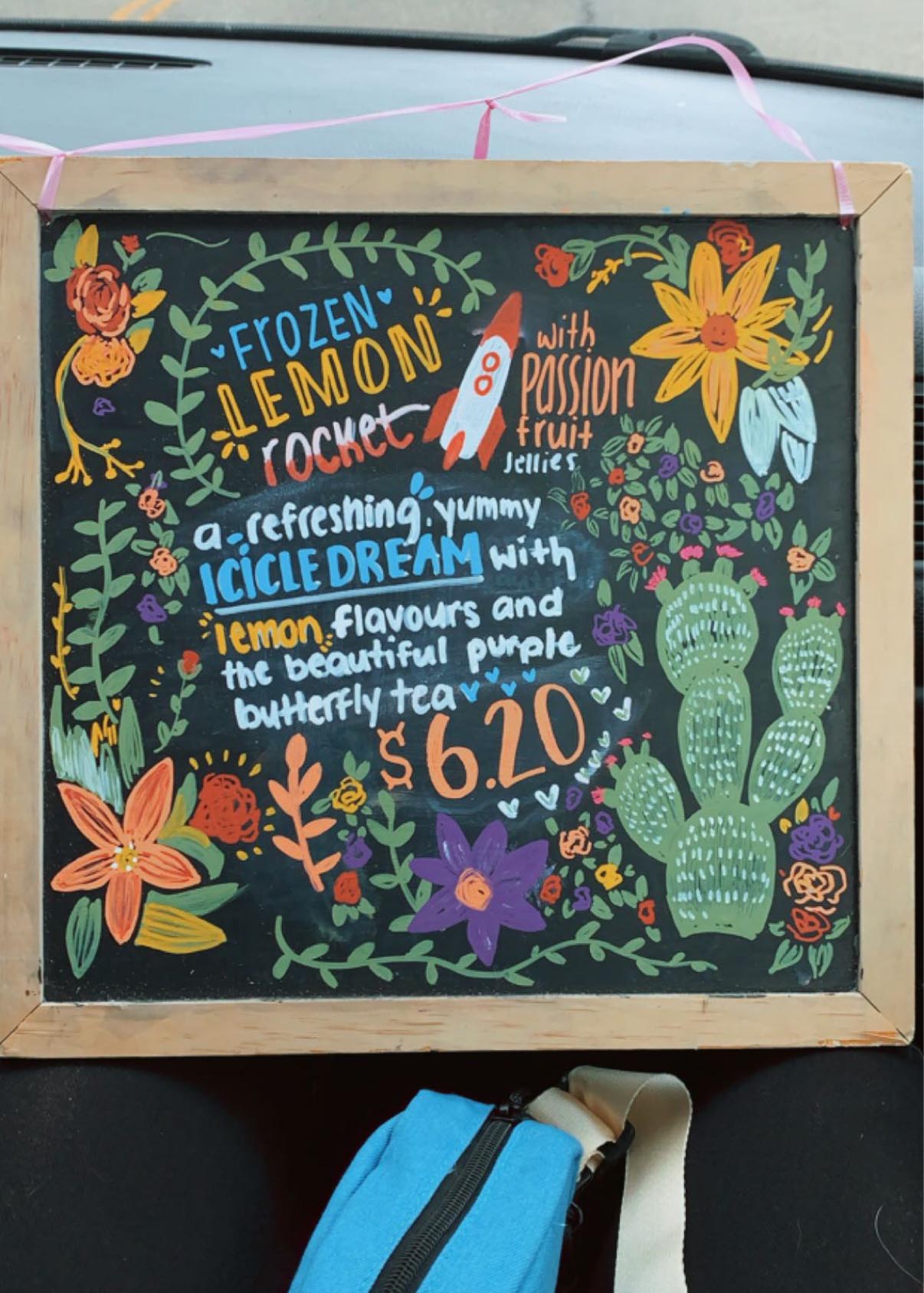 Chalkboard sign for Sweet Dreams Reashop that read, Frozen Lemon Rocket
