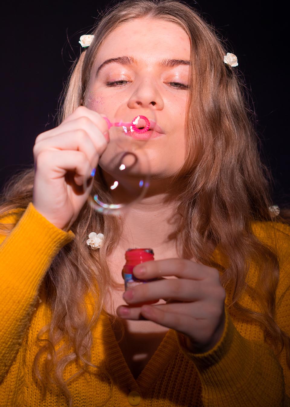Woman blowing bubbles